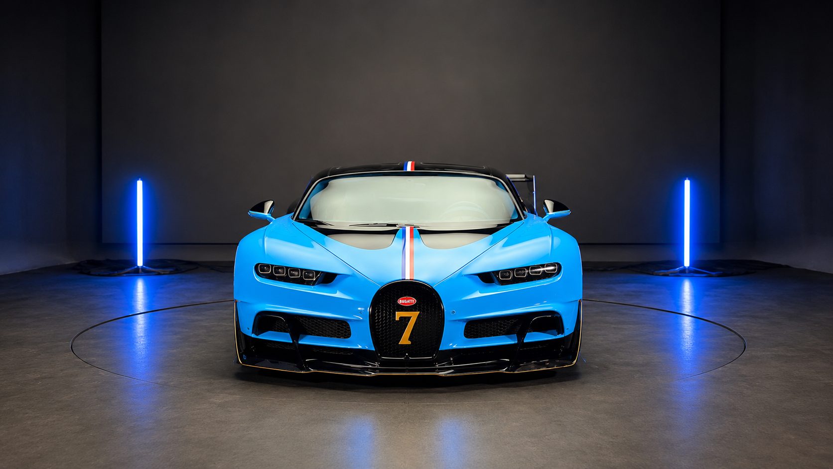 Blue hypercar from the Venuum project in a studio