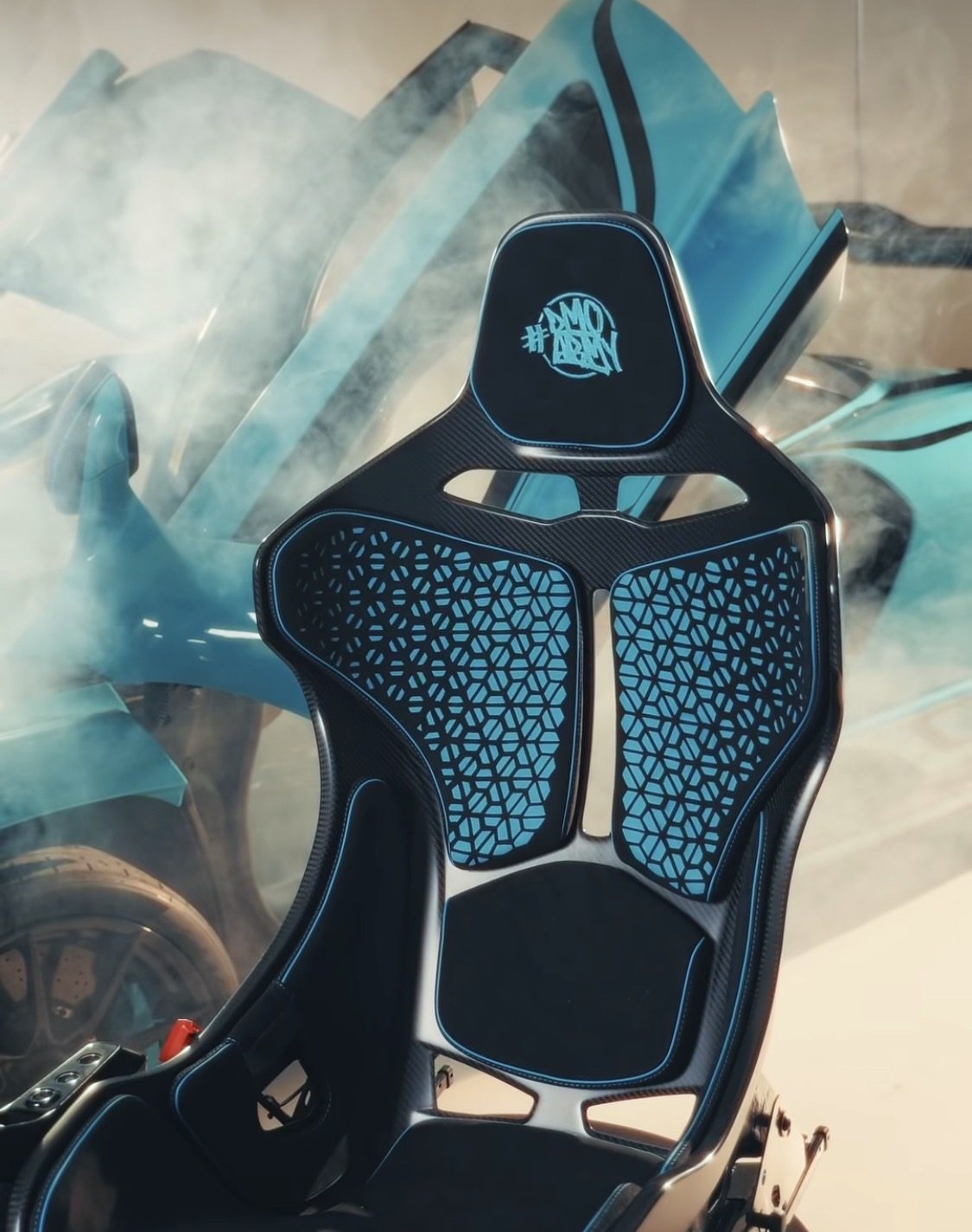 Racing seat with a laser-cut hexagon backrest pattern