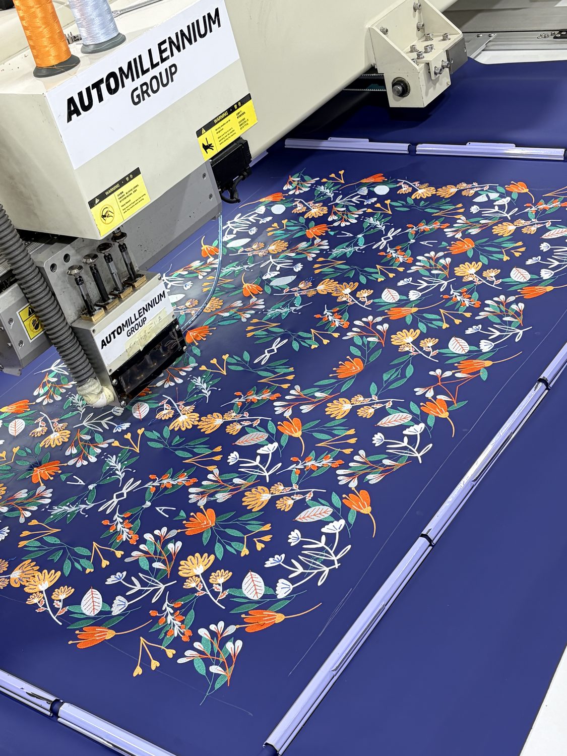 Floral embroidery in progress on the embroidery machine