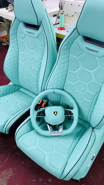 Teal seats with hexagon quilting