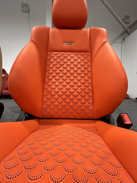 Orange seat with scale quilting