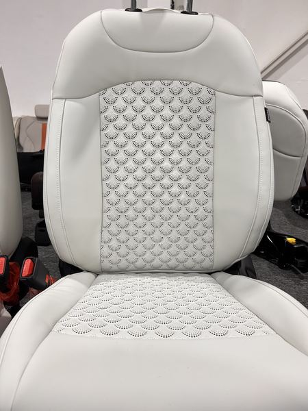 White seat with perforated diamond panel
