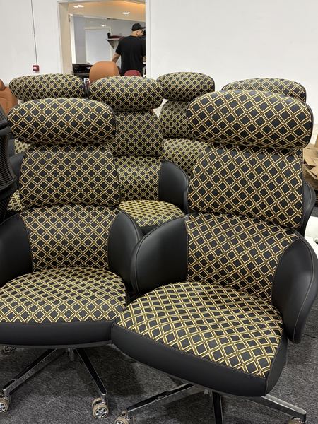 Lounge chairs in lattice-quilted fabric