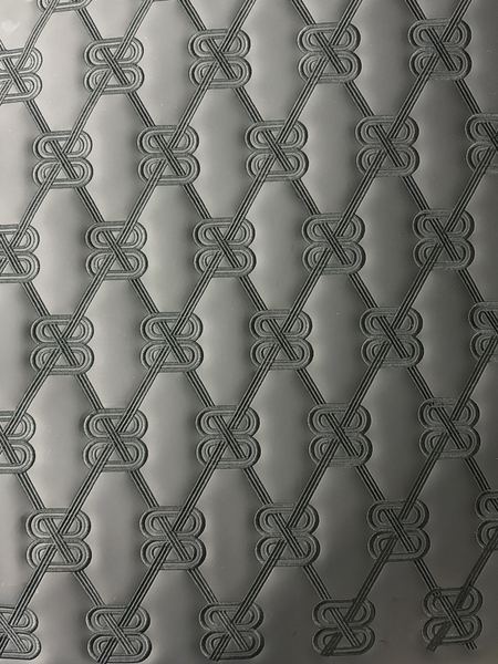 Embossed quilted pattern in grey