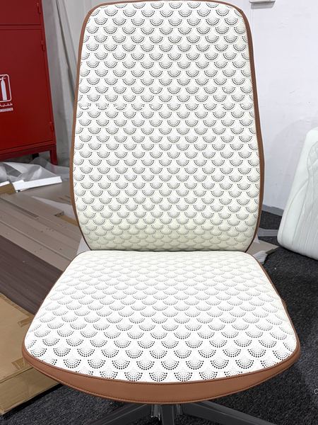 White chair with scale-pattern quilting