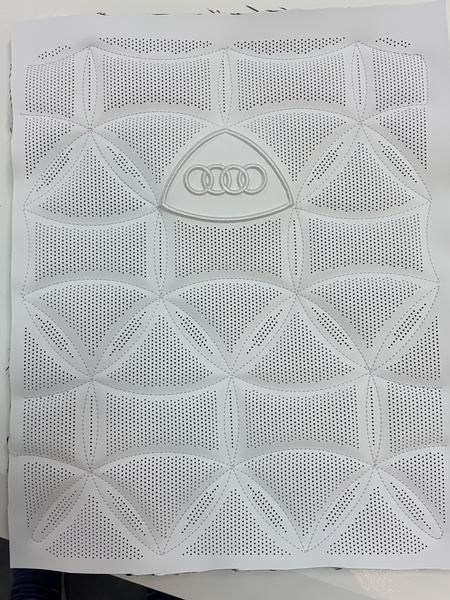 White quilted panel with Audi rings
