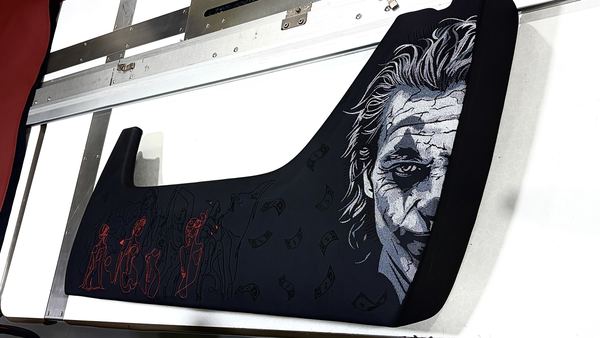 Joker portrait embroidery on a black panel