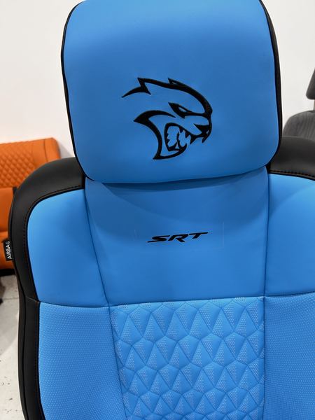 Hellcat logo embroidered on a blue seat