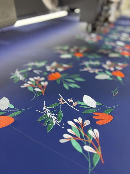 Floral embroidery on blue, detail