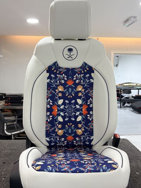 White seat with a floral embroidered insert
