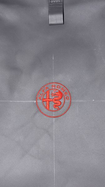 Alfa Romeo badge in red on grey