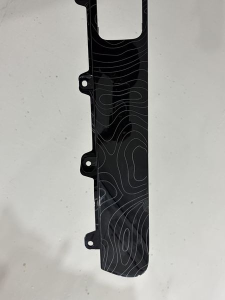 Laser-engraved trim panel