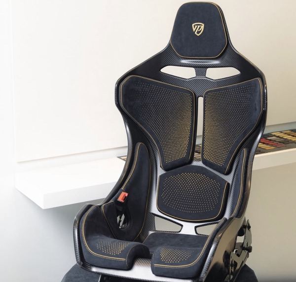Carbon sport seat with laser-perforated panels